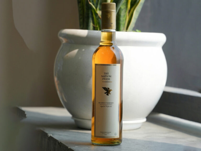 Close-up shot of The Nation Pride Whisky showing rich amber color