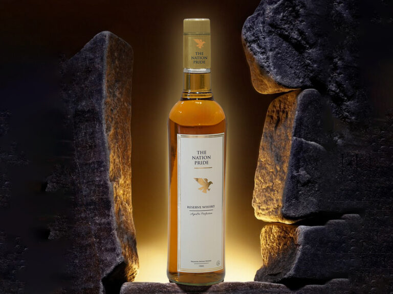 TheNationPrideWhisky bottle with ice cubes and classic whisky glass