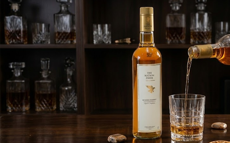 Close-up of The Nation Pride Whisky highlighting rich flavor and affordable pricing, a top choice for best whisky under ₹1500.